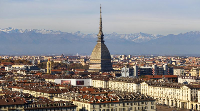 Discover the stunning cityscape of Turin with the iconic Mole Antonelliana and the Alps in the background.